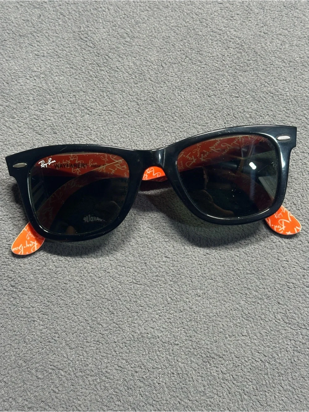 Ray-Ban Black Frame Sunglasses with Red Temples and Green Lenses